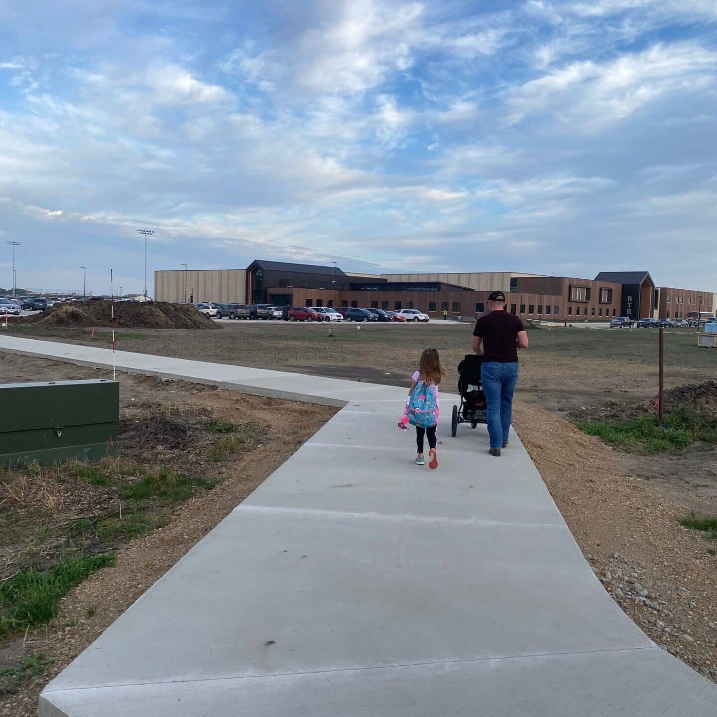 Parent walking student to school